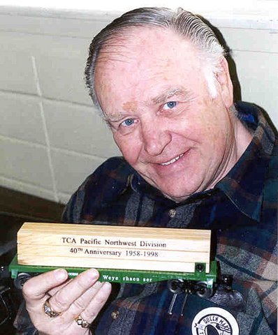ronsmithshowingoffhispnwdlumberflatraffleprize.jpg